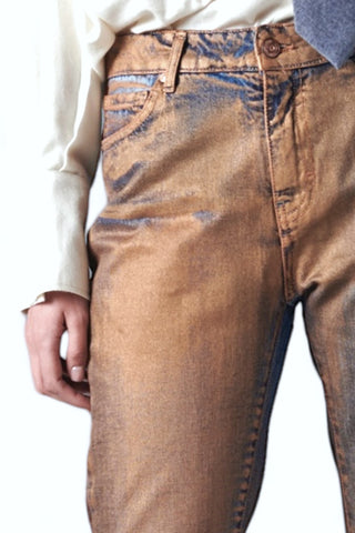 Pantaloni cigarette in denim perlato ruggine