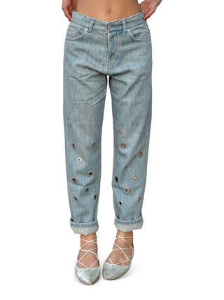 Pantaloni denim slegato relaxed con applicazione occhielli